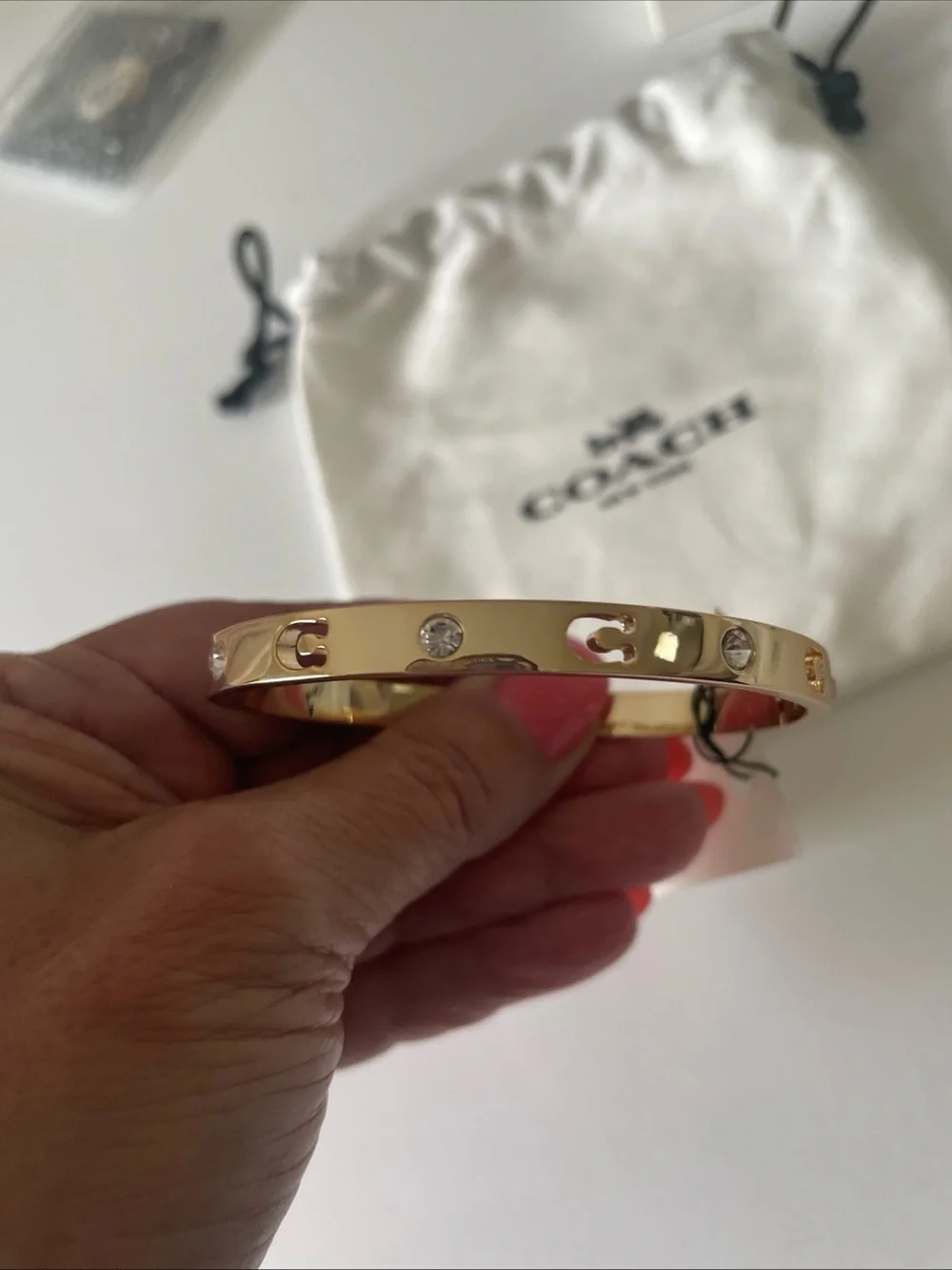 Coach  Gold Tone with crystals Slim Hinged Bangle